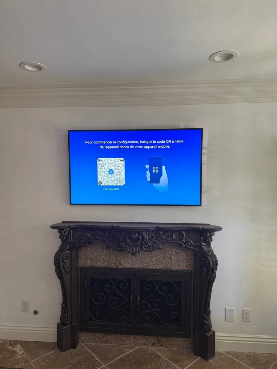 Concealed TV Mount Over a Carved Fireplace Mantel